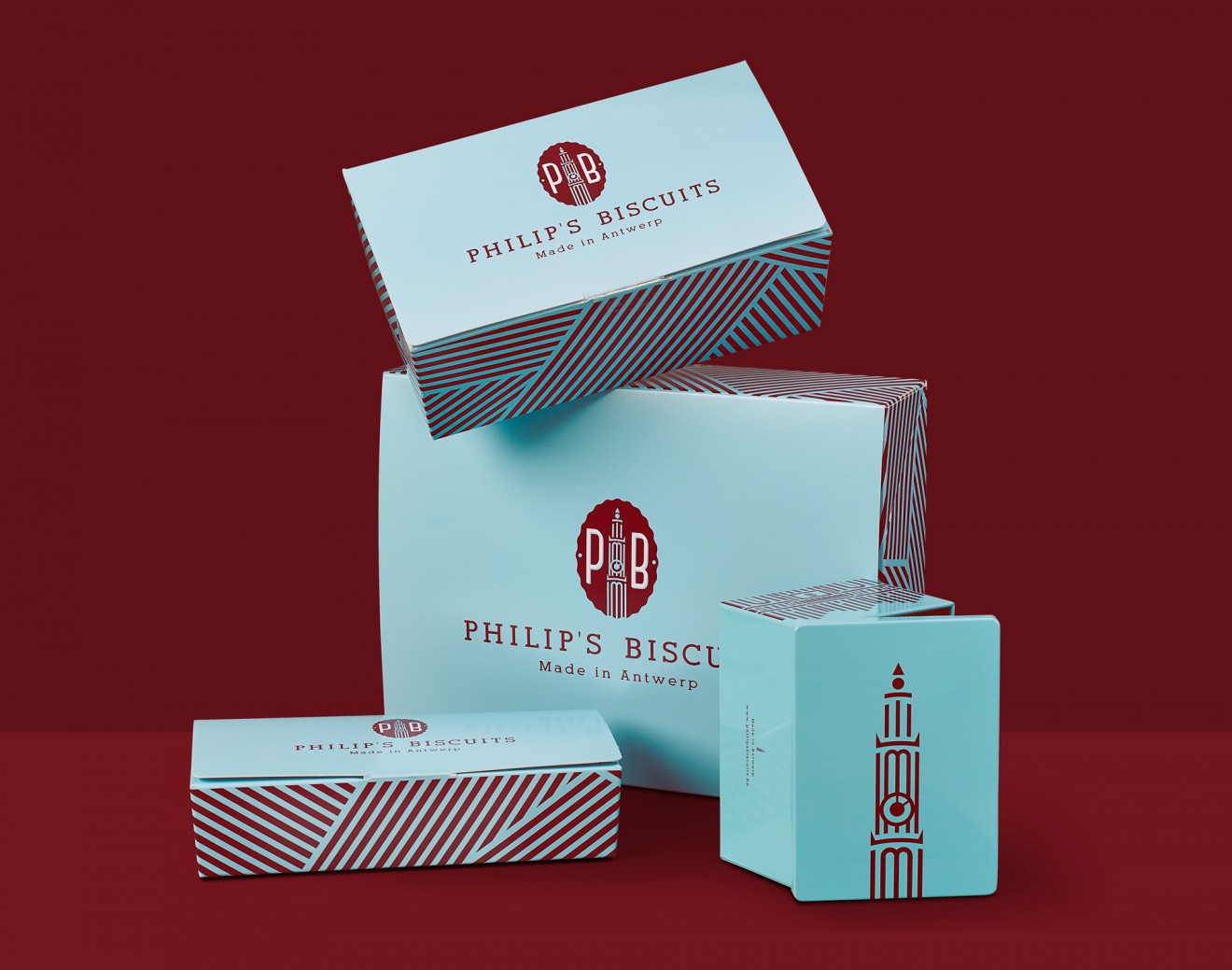 Quatre Mains package design - blauw, bordeaux, blikken ballotins, philips biscuits